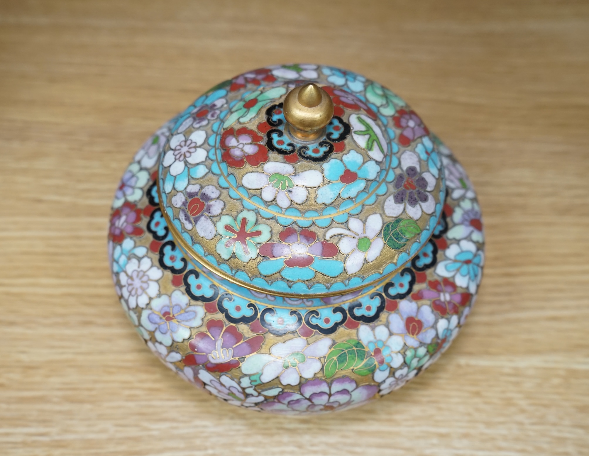 A 20th century Chinese cloisonné enamel pot and cover, 14cm. Condition - good